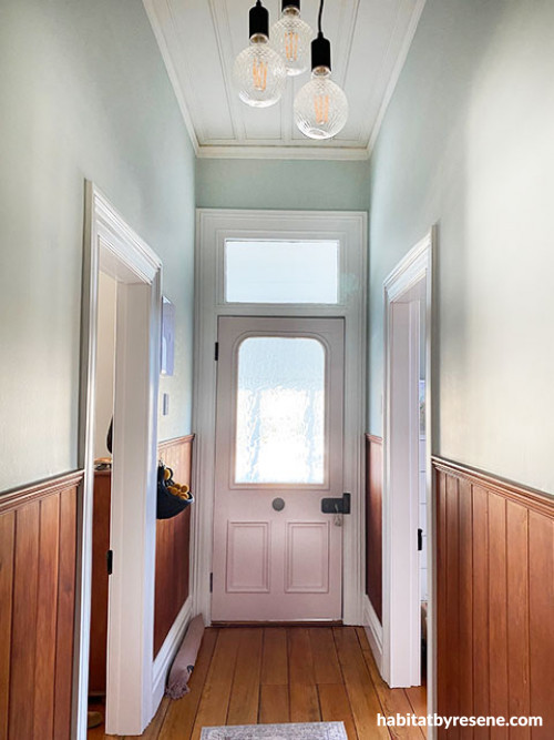 pastel hallway pink door