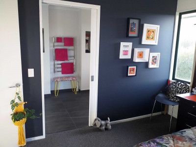 A funeral assistant looks on the bright side of life using bold Resene Scrumptious and Resene Fizz in her home