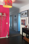 A funeral assistant looks on the bright side of life using bold Resene Scrumptious and Resene Fizz in her home
