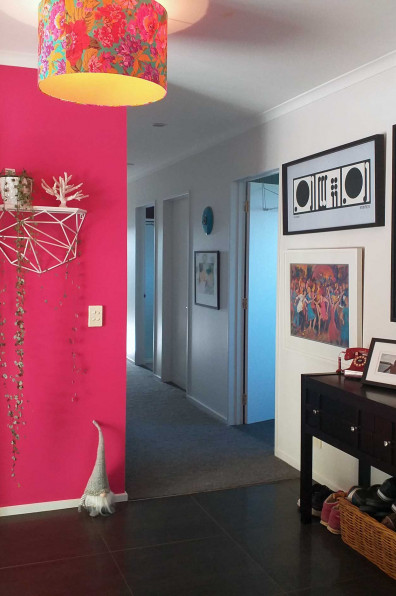 A funeral assistant looks on the bright side of life using bold Resene Scrumptious and Resene Fizz in her home A funeral assistant looks on the bright side of life using bold Resene Scrumptious and Resene Fizz in her home