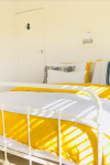 Beachside cottage bought online on an impulse receives a contemporary coastal refresh while retaining original bach style